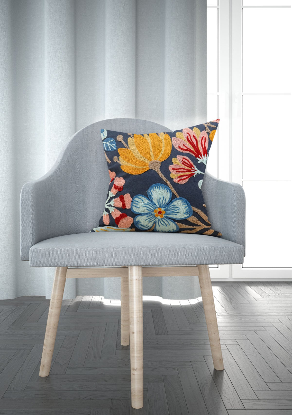 Blue floral cushion cover featuring elegant blossoms and intricate details