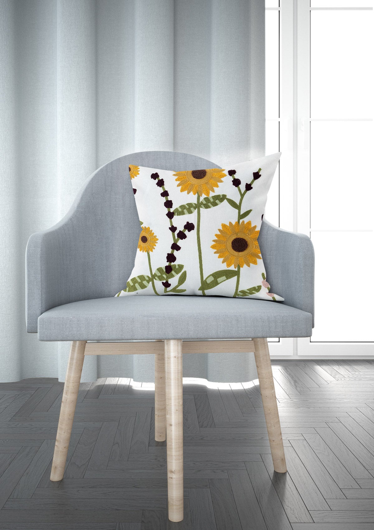 Vibrant sunflower cushion cover with intricate yellow petals and a touch of green foliage