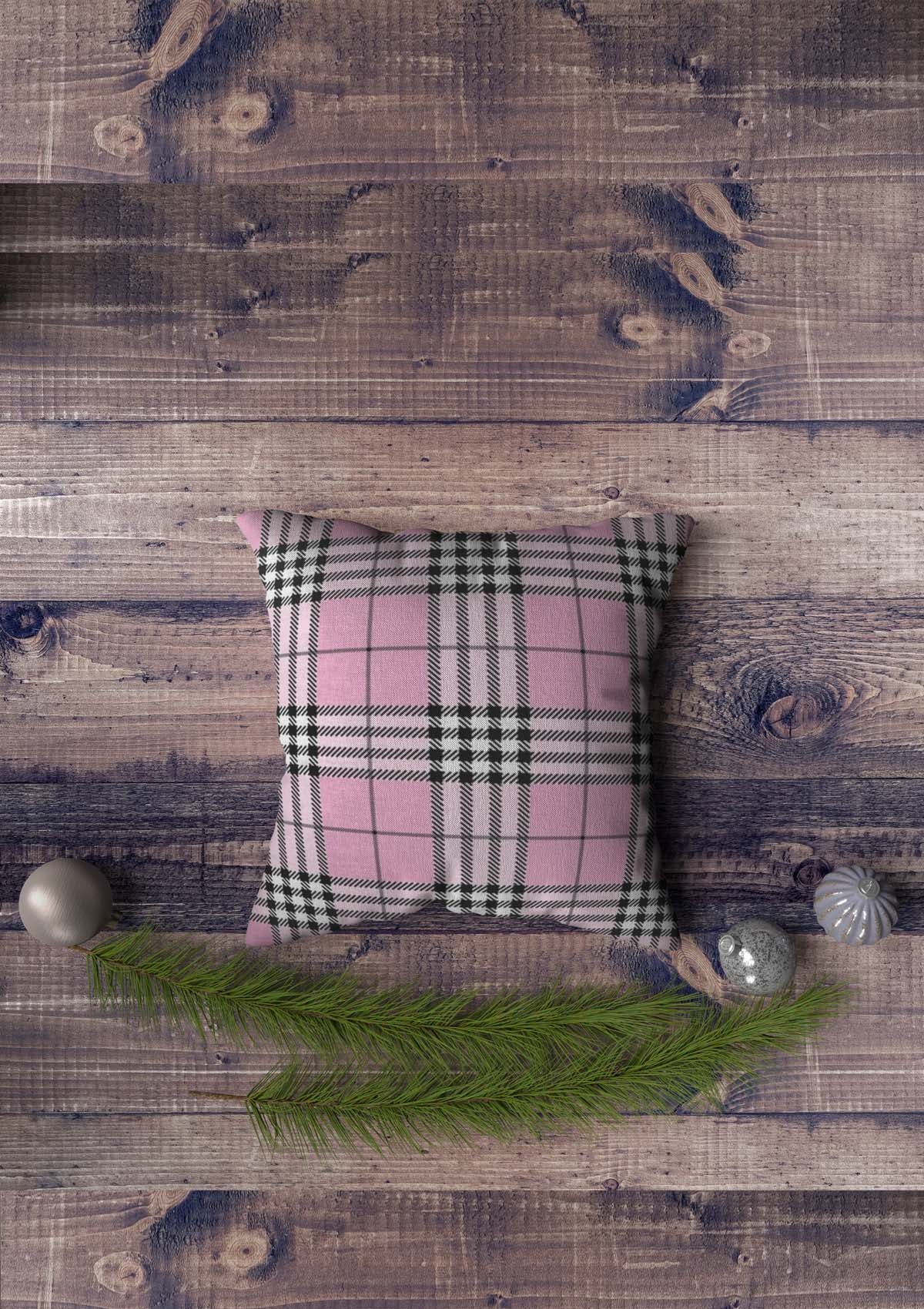 pink tartan cushion cover on the floor